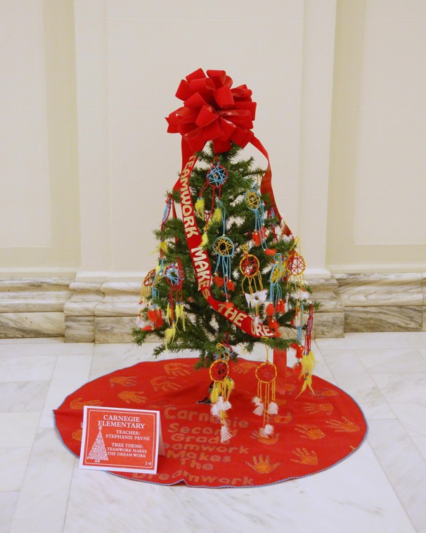 The Christmas tree decorated by Carnegie Elementary students in Stephanie Payne’s second grade class features the theme, “Teamwork makes the dream work.”   The Carnegie Elementary class joined almost 700 students from across the state to decorate 26 Christmas trees throughout the State Capitol building on November 30.