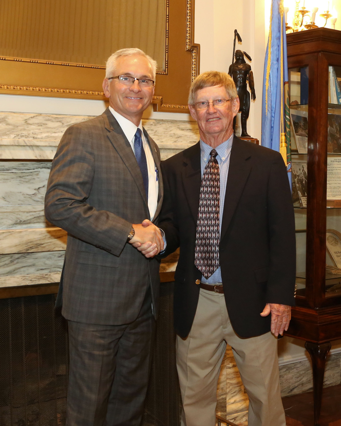 Sen. Darcy Jech, R- Kingfisher greets Southeastern Oklahoma State University baseball coach, Mike Metheny, at the State Capitol on Tuesday, May 9. 