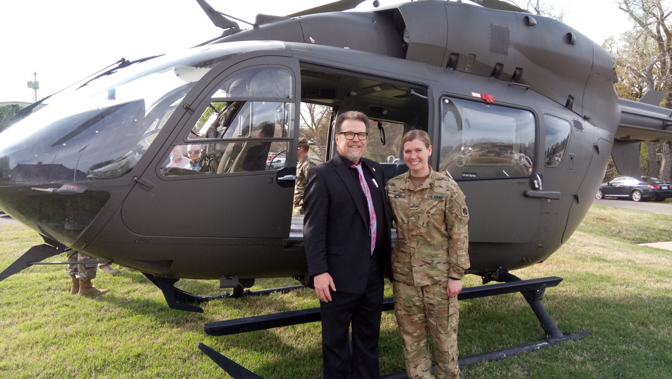 Senator Micheal Bergstrom, R-Adair (left), joins Chief Warrant Officer 2, Rachel Deal, as he looks over the LUH-72 "Lakota" helicopter on display at the reception Tuesday night at the 45th Infantry Division Museum in Oklahoma. The helicopter is one of four in the National Guard’s fleet.