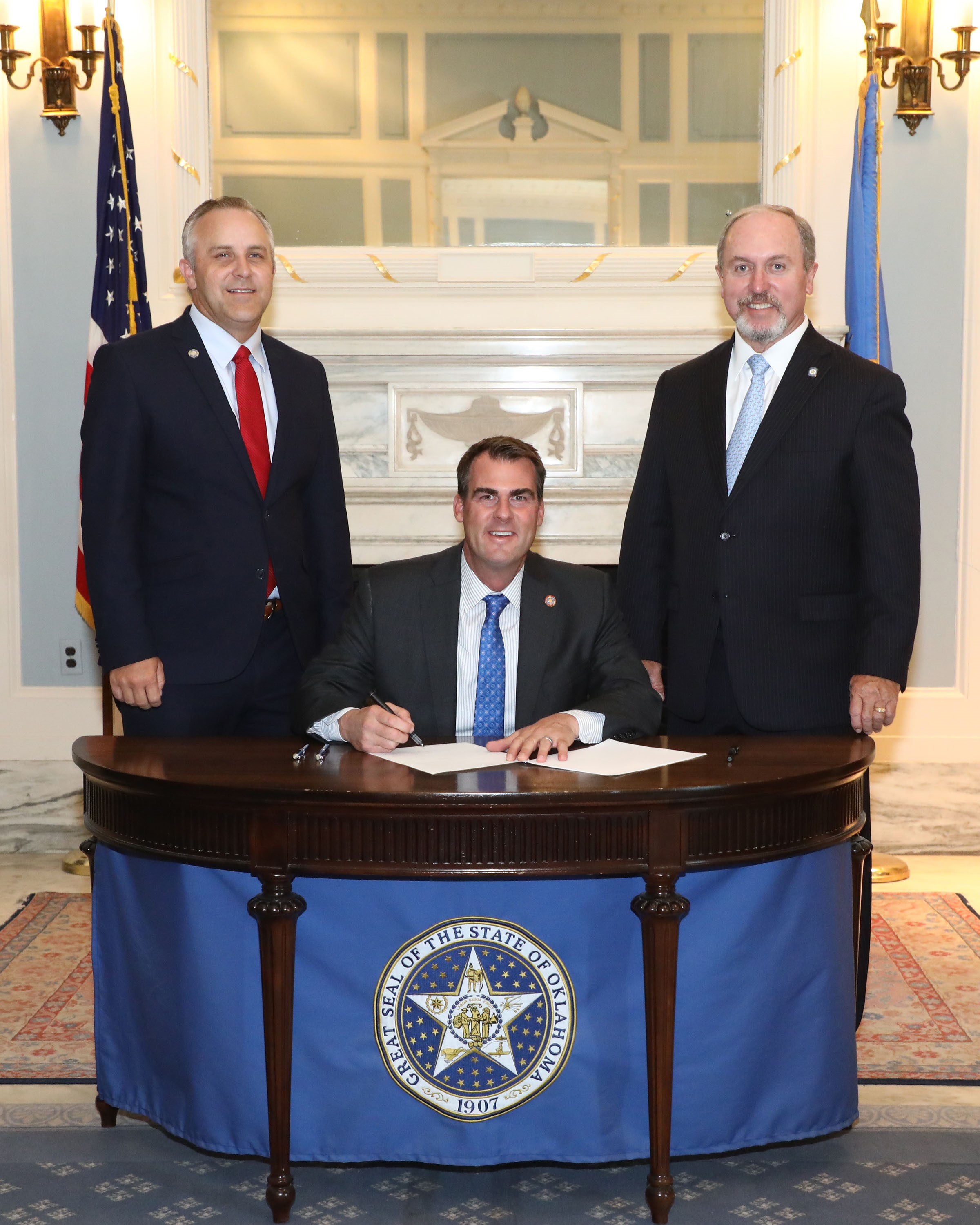 Senate President Pro Tempore Greg Treat, R-Oklahoma City, Gov. Kevin Stitt and Sen. Marty Quinn, R-Claremore, held a ceremonial bill signing at the state Capitol for Senate Bill 441 which is aimed at encouraging districts to return to a five-day school week.