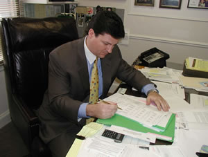 Sen. Easley studies billing information related to payments to Oklahoma City political consultant Mary Myrick.