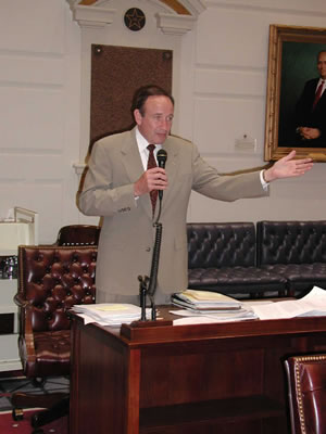 Senator Cal Hobson, the next leader of the State Senate, debates a point on the Senate floor.