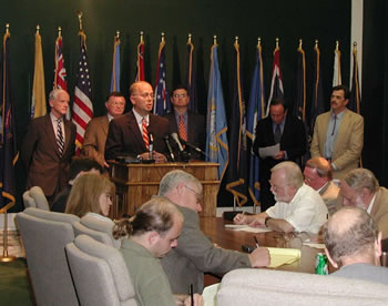 Senator Stratton Taylor announces tax cuts and budget agreements at a State Capitol news conference.