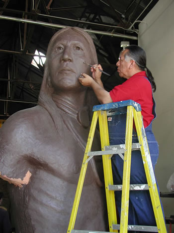 Master Artist and State Senator Kelly Haney sculpting "The Guardian."
