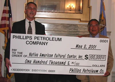 H.J. Reed, Director of Government Relations for Phillips Petroleum joined State Senator Kelly Haney (D-Seminole) in announcing a $100,000 donation to the Native American Cultural Center and Museum.