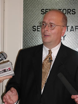 Senate President Pro Tempore Stratton Taylor discusses the 2002 legislative session at a State Capitol news conference.