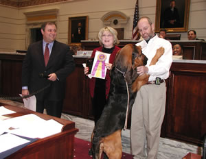 Sen. Coffee, Wendy and Chuck Musgrove and Westminster winner Barkley the Bloodhound.