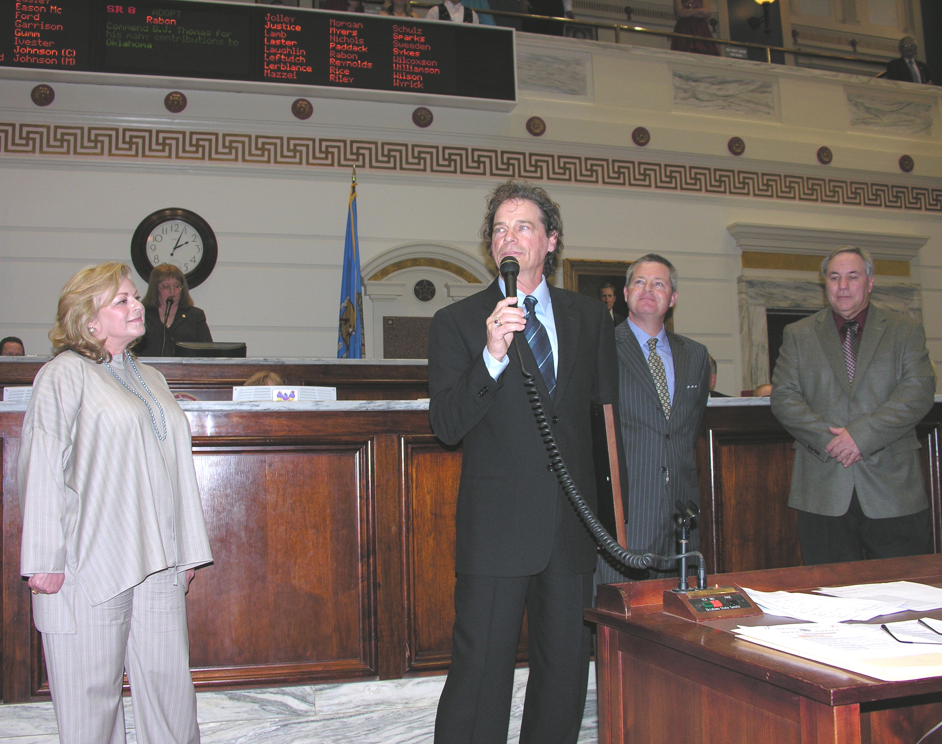 B.J. Thomas addresses Senate while his wife Gloria, Sen. Jeff Rabon and Huge Mayor Stan Payne look on