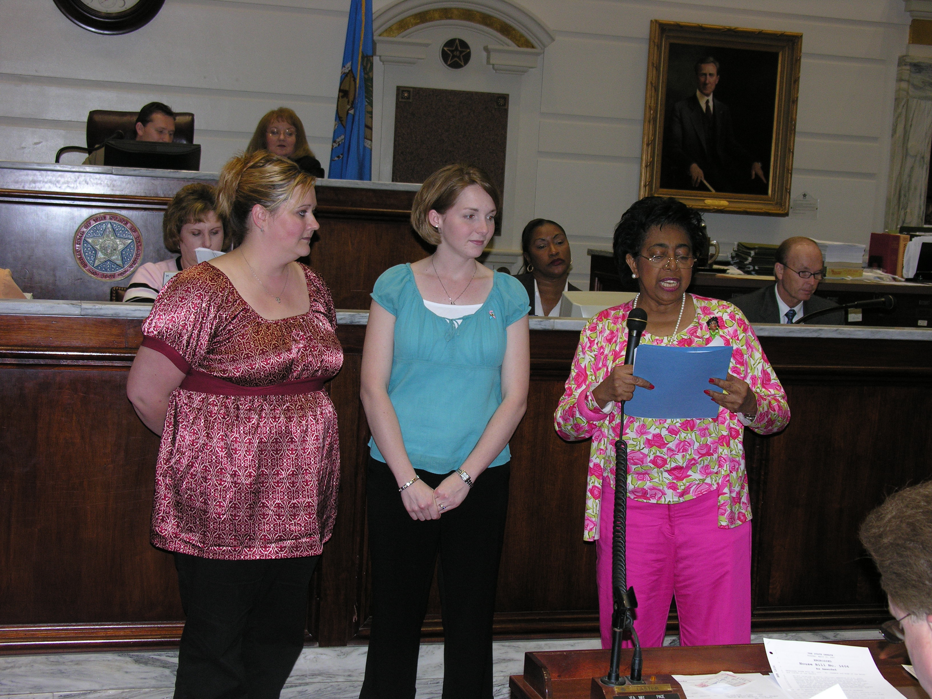 Ronda Lawmaster and Erica Blystone listen as Senator Eason McIntyre explains SCR 25