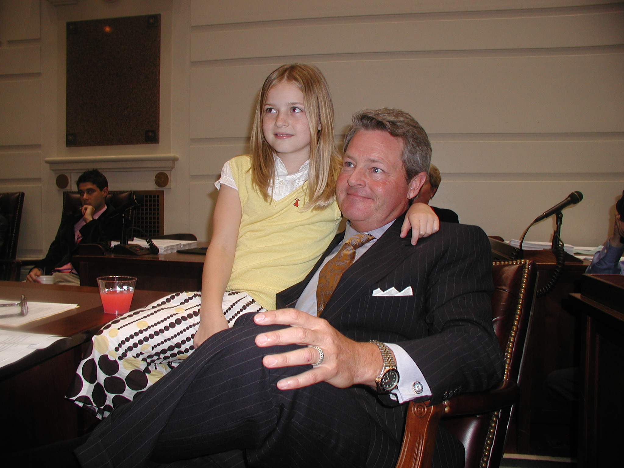 Sen. Jeff Rabon and daughter Berrie Shannon listen as members of the Senate salute his 12 years of service.