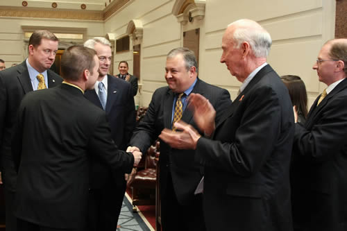 A delegation consisting of the five Republican freshmen Senators congratulate Sen. Coffee for being elected as Pro  Tem of the Senate before escorting him to the President's chair. 