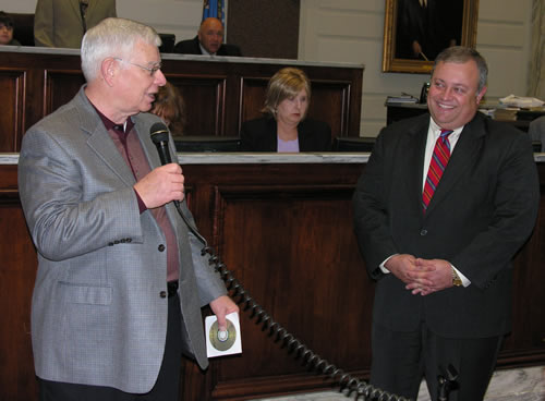 Long-time Capitol reporter John Greiner thanks the Senate for their recognition.