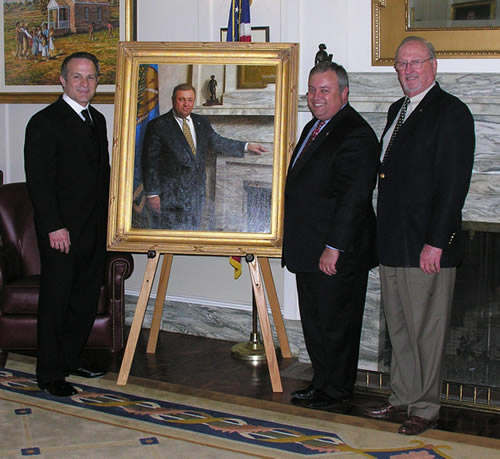 Senate President Pro Tempore Glenn Coffee poses alongside his portrait with artist Mike Wimmer and Senate Preservation Fund president Charles Ford.