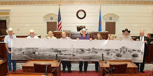 Sen. Myers presents the 101 Ranch OTA on the Senate Floor with a large panoramic picture of the ranch to be displayed at the 101 Ranch Old Timers Museum in Ponca City.