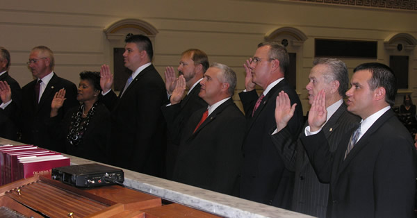 Senators take their Oath of Office in the Senate Chamber on Statehood Day.