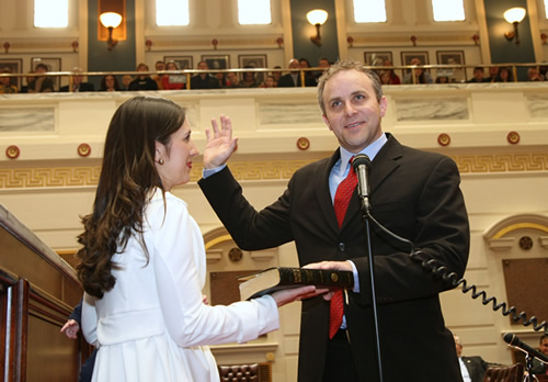 Sen. Greg Treat is sworn into office in the Senate Chamber on Wednesday, as wife Maressa holds the Bible.