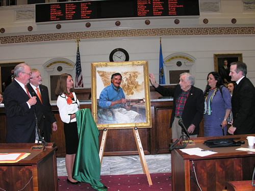 Portrait sponsors Howard and Billie Barnett and Charles Wilson unveil his portrait on the Senate floor Wednesday. 