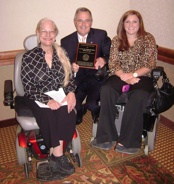 Disability Concerns Chair Pam Henry, Pro Tem Bingman and former intern. Hailey Mathis with the Employer of the Year Award.