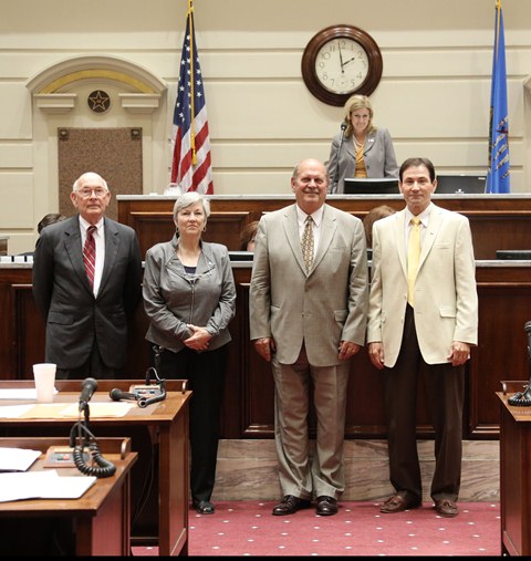 The Senate honored the life and accomplishments of Gordon Cooper Wednesday on the 50th anniversary of his space flight on May 15, 1963 with Senate Resolution 34.  Pictured (L-R): Dr. Tom Terry, Judith Michner, Shawnee mayor Wes Mainord and Sen. Ron Sharp