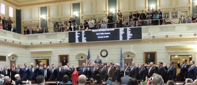 The Honorable John Reif, Chief Justice of the Supreme Court, administers the oath of office to newly elected and reelected members of the Senate.  