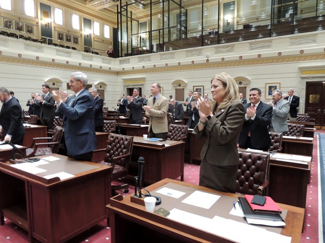 Members of the Senate give a standing ovation to newly elected Senate President Pro Tempore Mike Schulz.