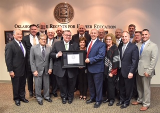 CUTLINE: Sen. Dewayne Pemberton and Higher Education Chancellor Dr. Glen D. Johnson pose with the State Regents and college presidents from around the state. Pictured L-R: State Regent Emeritus Andy Lester, Oklahoma Panhandle State University President T