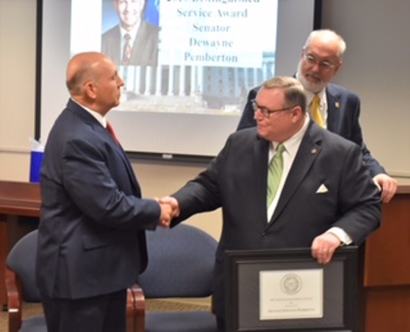 Chancellor of Higher Education Dr. Glen D. Johnson presents Sen. Dewayne Pemberton with the 2019 Distinguished Service Award for Higher Education at the State Regents meeting on Thursday, October. 24.